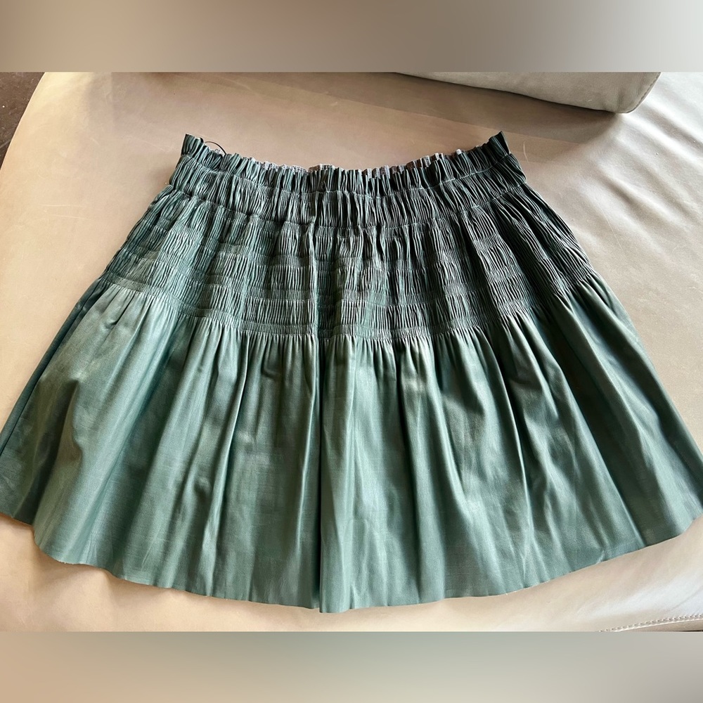 7 for all Mankind pleated mini skirt, Sz L Army green faux leather stretch